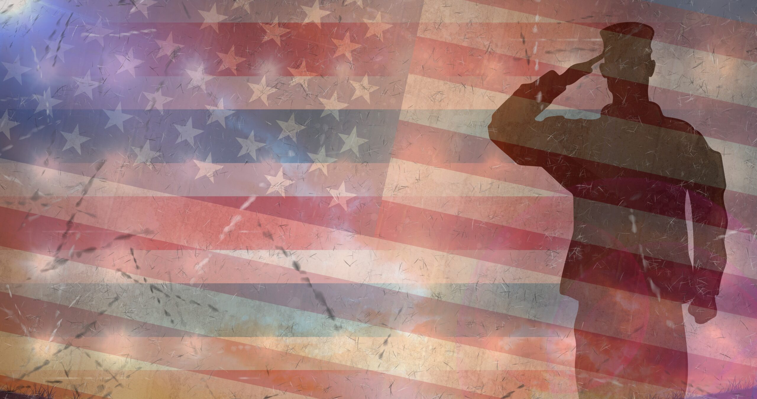 Silhouette of a male soldier saluting the U.S. flag